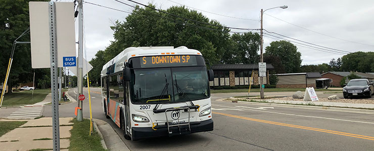 Metro Transit bus approaching bus stop on Bristol Street in Sun Prairie